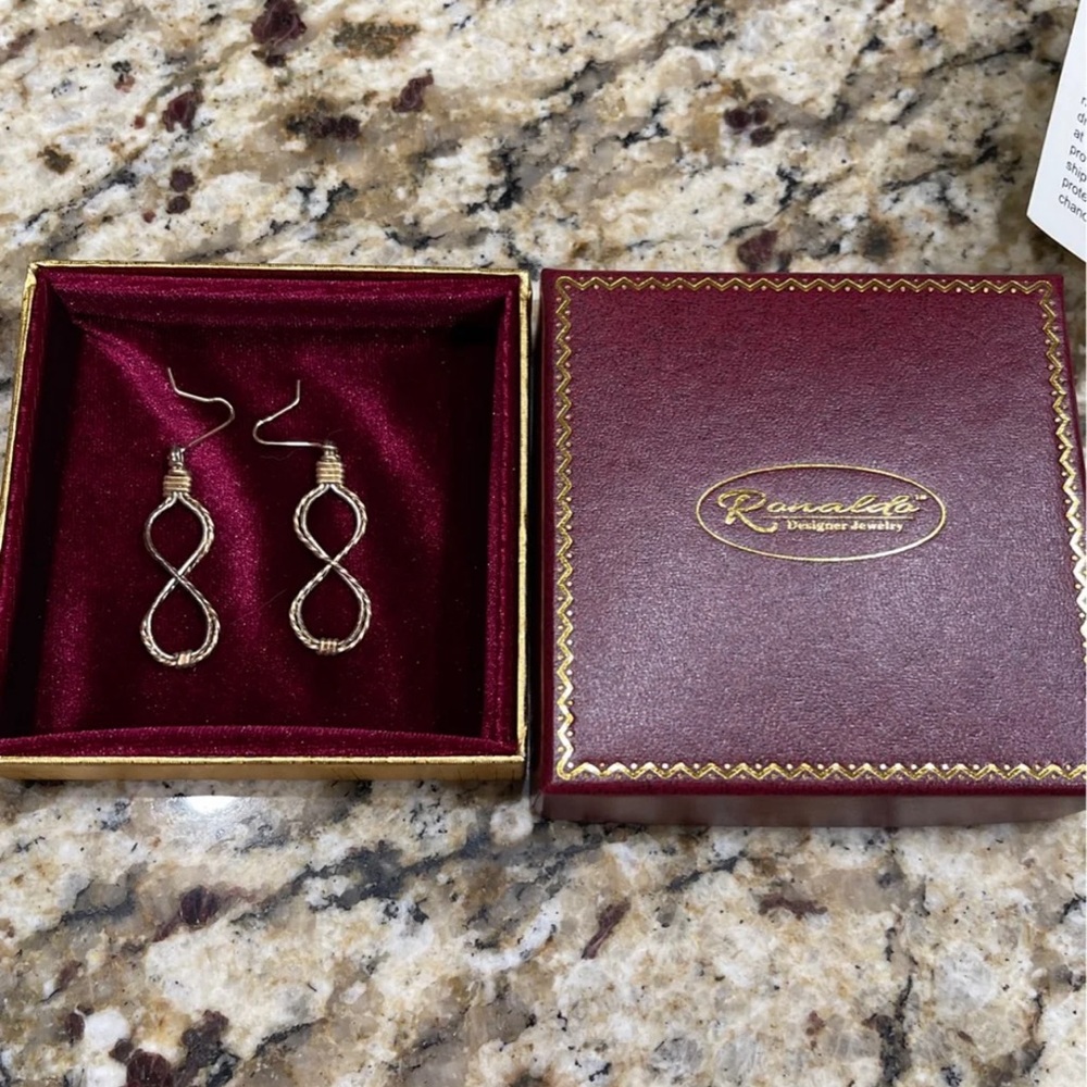 Ronaldo “Braided together for life” earrings.